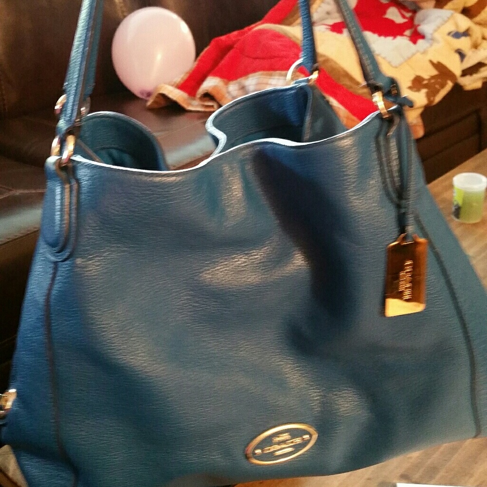 Beautiful Coach saddle leather Edie shoulder bag.